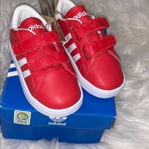 Red Adidas striped shoes